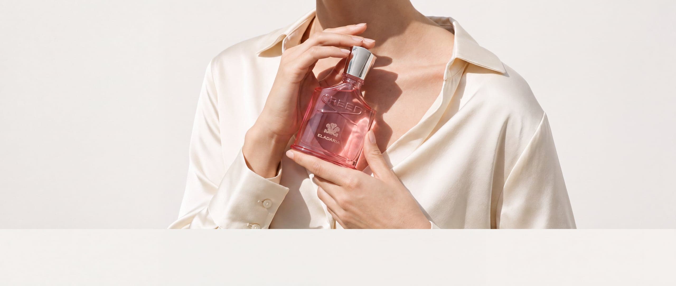 Creed Aventus For Her in a bright studio